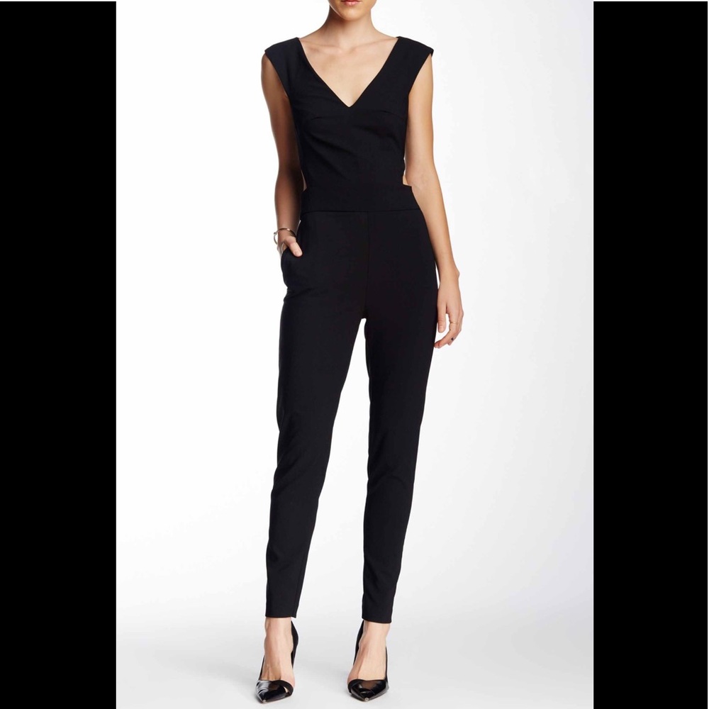 Sexy black jumpsuit with cut out side details.